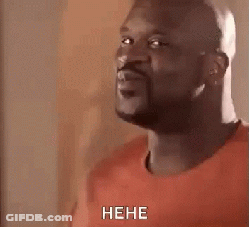 A Man With A Beard Is Making A Funny Face And Laughing While Wearing A Red Shirt . GIF