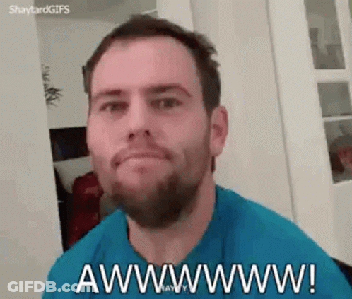 A Man With A Beard Is Making A Funny Face And Saying Awwwwww ! GIF