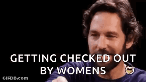 A Man With A Beard Is Making A Funny Face And Saying `` Getting Checked Out By Women '' . GIF