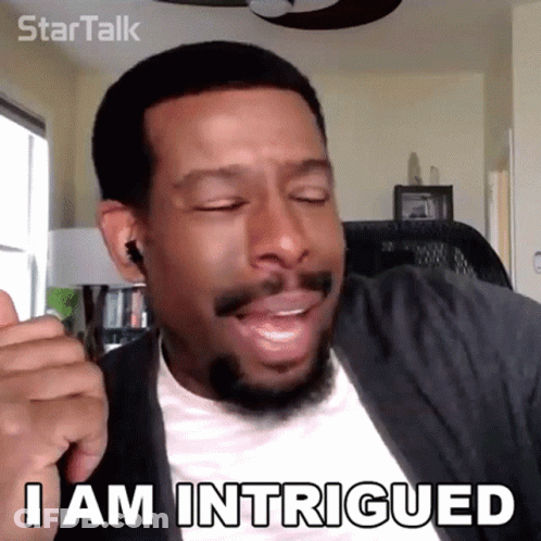 A Man With A Beard Is Making A Funny Face And Saying " I Am Intrigued " GIF