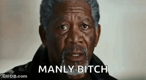 A Man With A Beard Is Making A Funny Face And Saying Manly Bitch . GIF