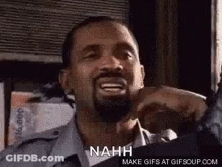 A Man With A Beard Is Making A Funny Face And Saying Nah . GIF