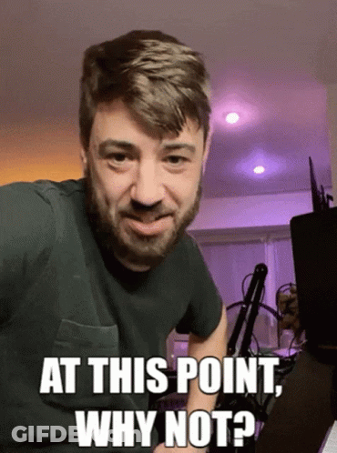 A Man With A Beard Is Making A Funny Face And Says At This Point Why Not GIF