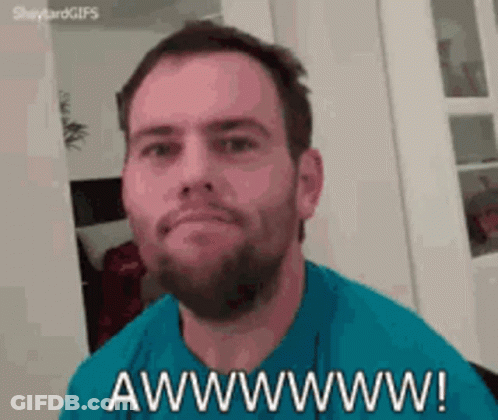 A Man With A Beard Is Making A Funny Face And Says Awwwwww . GIF