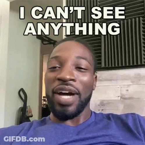 A Man With A Beard Is Making A Funny Face And Says I Can T See Anything GIF