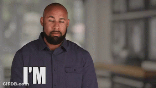 A Man With A Beard Is Making A Funny Face And Says I 'M GIF