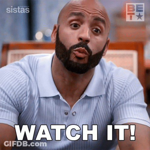 A Man With A Beard Is Making A Funny Face And Says Watch It GIF