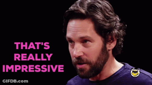A Man With A Beard Is Making A Funny Face And The Words `` That 'S Really Impressive '' Are Above Him . GIF