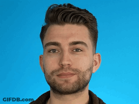 A Man With A Beard Is Making A Funny Face GIF