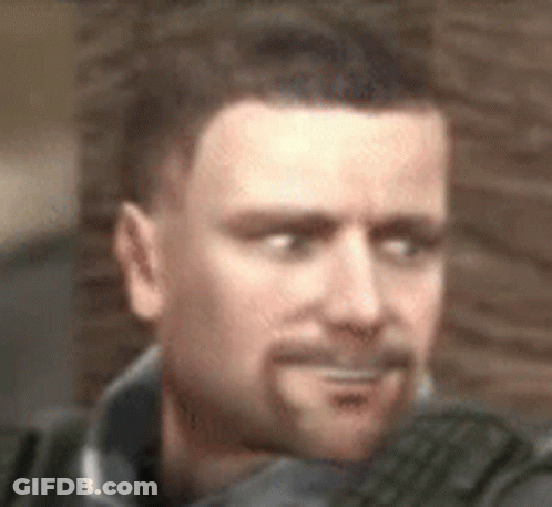 A Man With A Beard Is Making A Funny Face In A Blurry Photo . GIF