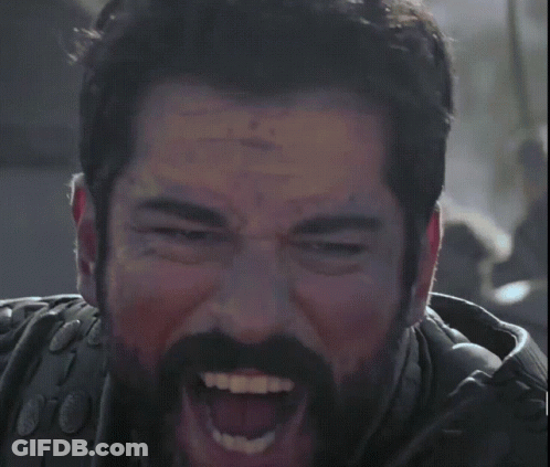 A Man With A Beard Is Making A Funny Face GIF