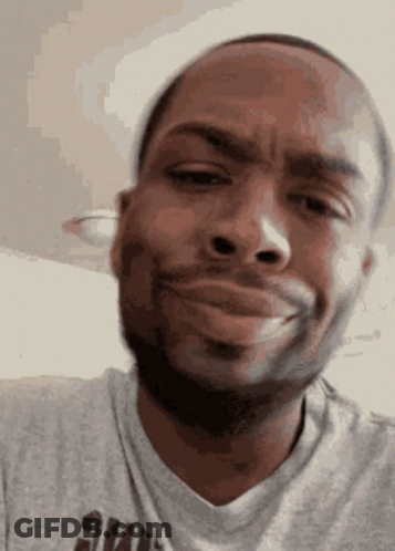 Man With Beard Making Funny Face In Gray Shirt GIF