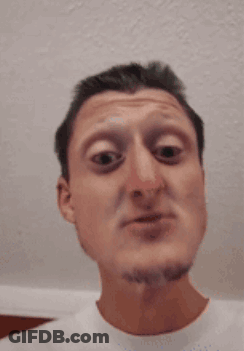 A Man With A Beard Is Making A Funny Face With His Eyes Closed GIF