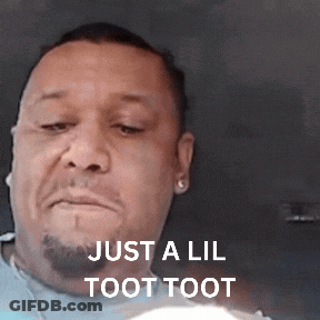 A Man With A Beard Is Making A Funny Face With The Words Just A Lil Toot Toot Above Him . GIF
