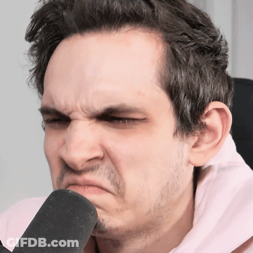 A Man With A Beard Is Making A Funny Face GIF