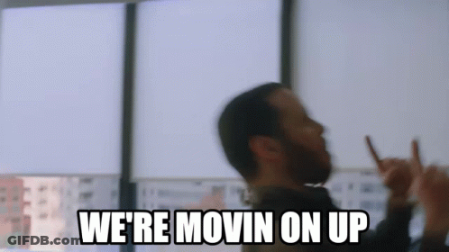 A Man With A Beard Is Making A Peace Sign And Says `` We 'Re Movin On Up '' GIF