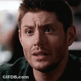 A Man With A Beard Is Making A Surprised Face . GIF