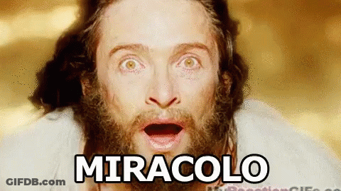 A Man With A Beard Is Making A Surprised Face And The Word Miracolo Is Written Above Him . GIF