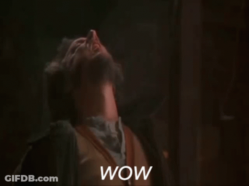 A Man With A Beard Is Making A Surprised Face And The Word Wow Is Visible In The Foreground GIF