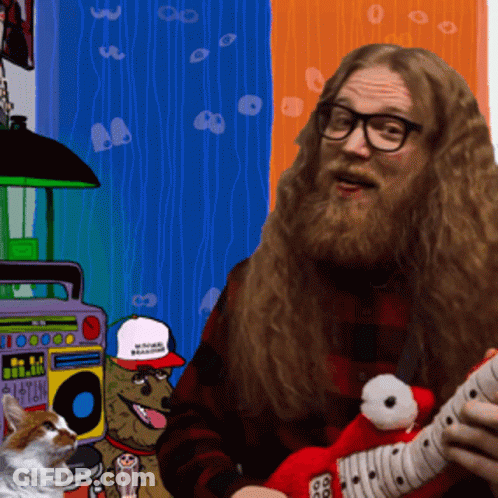 A Man With A Beard Is Playing A Guitar In Front Of A Boombox That Says I Love You GIF
