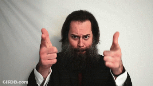 A Man With A Beard Is Pointing At The Camera With Both Hands GIF