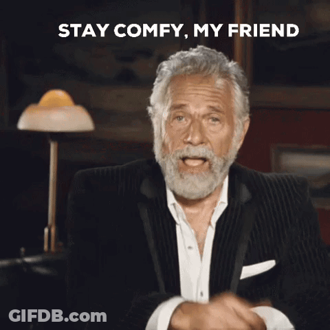 A Man With A Beard Is Pointing At The Camera With The Words Stay Comfy My Friend Behind Him GIF