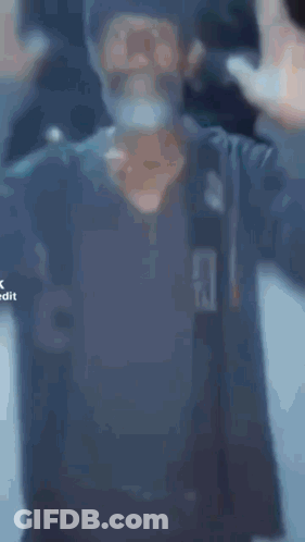 A Man With A Beard Is Praying With The Word Expansion In The Corner GIF