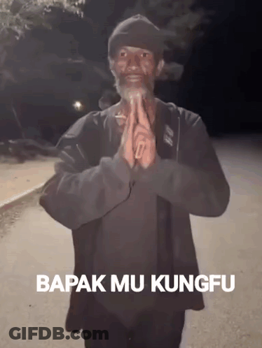 A Man With A Beard Is Praying With The Words Bapak Mu Kungfu On The Bottom Right GIF