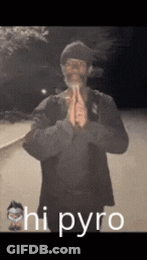 A Man With A Beard Is Praying With The Words " Hi Pyro " Behind Him GIF