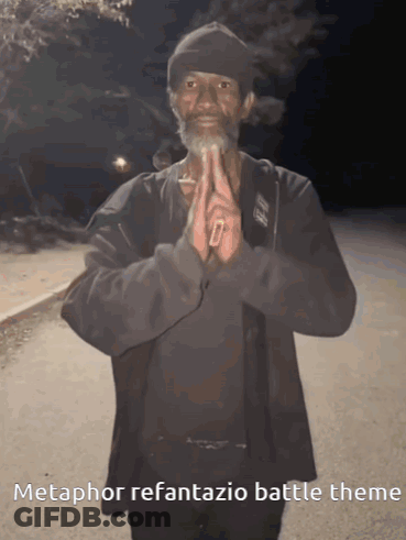 A Man With A Beard Is Praying With The Words Metaphor Refantasia Battle Theme Written Below Him GIF