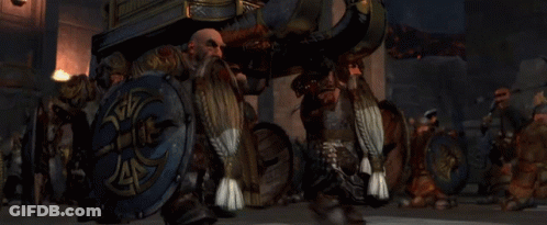 A Man With A Beard Is Reading A Book GIF