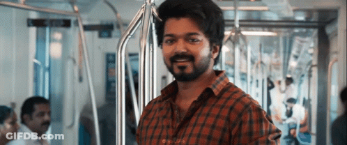 A Man With A Beard Is Riding A Subway Train . GIF