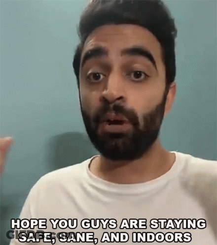 A Man With A Beard Is Saying `` Hope You Guys Are Staying Safe , Sane And Indoors '' GIF
