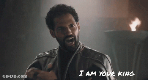 A Man With A Beard Is Saying " I Am Your King " In Front Of A Fire GIF