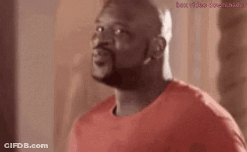 A Man With A Beard Is Saying `` I 'M Baaack '' . GIF
