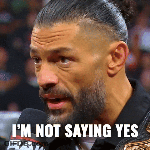 A Man With A Beard Is Saying I 'M Not Saying Yes In Front Of A Microphone GIF