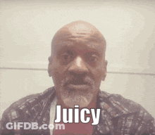 A Man With A Beard Is Saying Juicy In Front Of His Face GIF