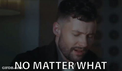 A Man With A Beard Is Saying No Matter What In A Dark Room . GIF