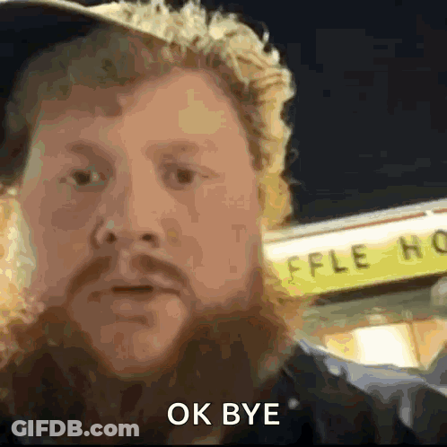 A Man With A Beard Is Saying Ok Bye In Front Of A Waffle House GIF