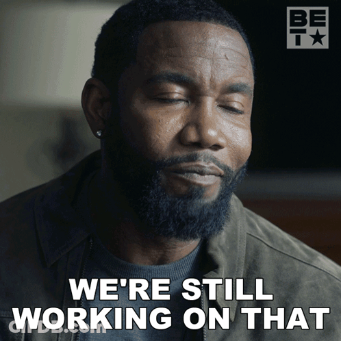 A Man With A Beard Is Saying " We 'Re Still Working On That " GIF