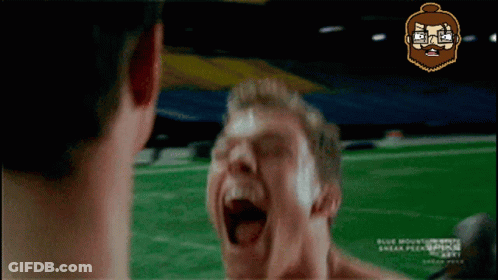 A Man With A Beard Is Screaming In Front Of Another Man GIF