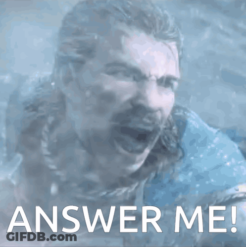 A Man With A Beard Is Screaming With The Words Answer Me Written Below Him GIF