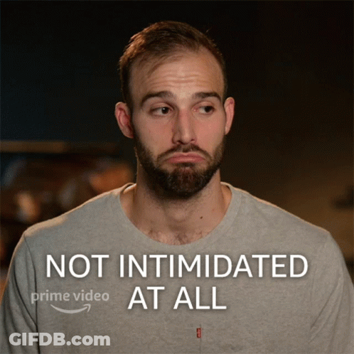 A Man With A Beard Is Shown With The Words Not Intimidated At All On The Bottom GIF