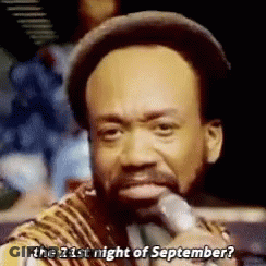 A Man With A Beard Is Singing Into A Microphone And Asking The 21St Night Of September . GIF