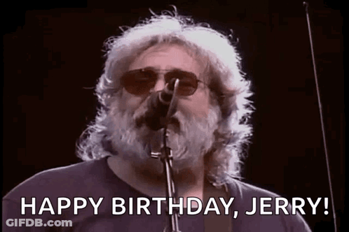 A Man With A Beard Is Singing Into A Microphone And Saying `` Happy Birthday Jerry '' . GIF