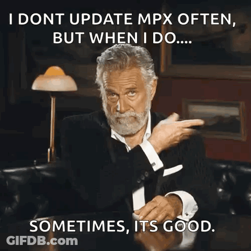 A Man With A Beard Is Sitting At A Table With A Caption That Says I Dont Update Mpx Often But GIF