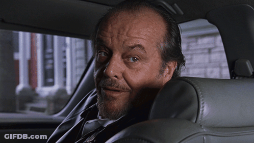 A Man With A Beard Is Sitting In A Car GIF