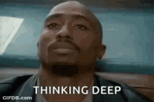 A Man With A Beard Is Sitting In A Car And Thinking Deep . GIF