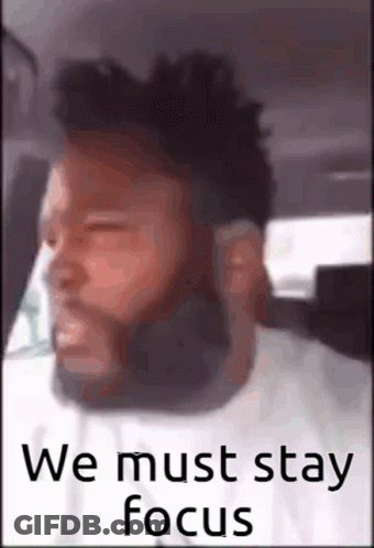 A Man With A Beard Is Sitting In A Car With His Eyes Closed . GIF