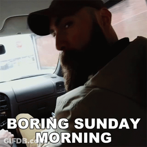 A Man With A Beard Is Sitting In A Car With The Words Boring Sunday Morning Above Him GIF